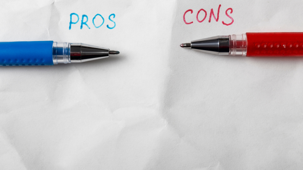Two pens each dictating a pro and a cons scenario